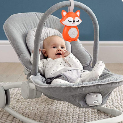 Bébé allongé dans transat avec Veilleuse bruit blanc Renard Musical Apaisant
