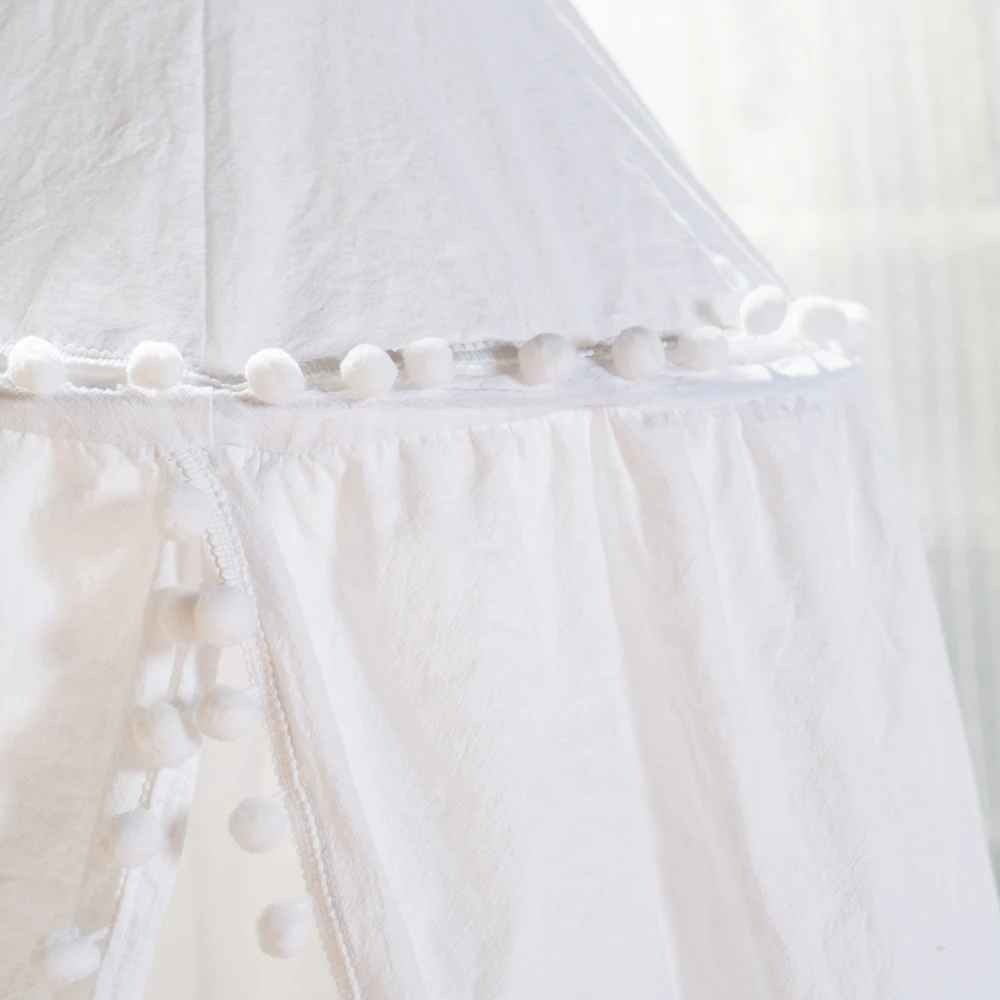 Ciel de lit blanc bebe avec pompons décoratifs finition élégante voile transparent Cocon protecteur