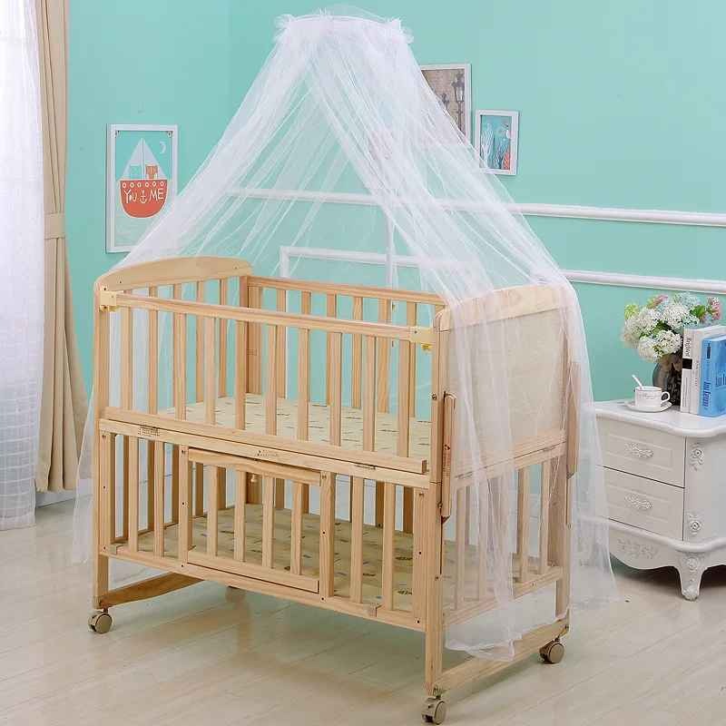 Ciel de lit moustiquaire bébé sur berceau bois DreamGuard