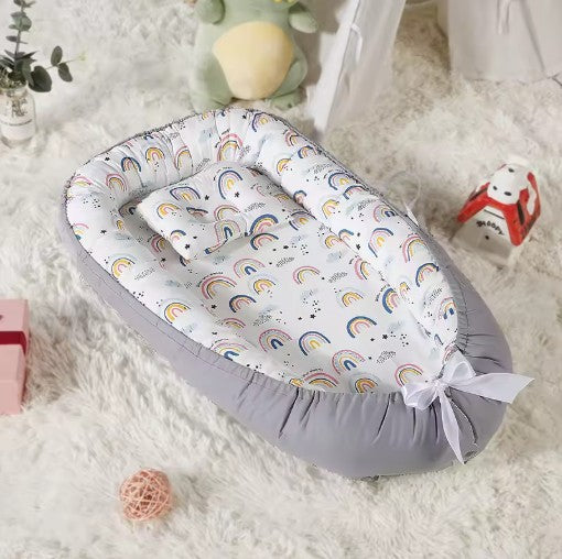 Cocon bébé compacte pratique nidportablebebe arc-en-ciel