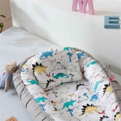 Cocon bébé nid douillet avec oreiller CozyCocoon DINOSAURE