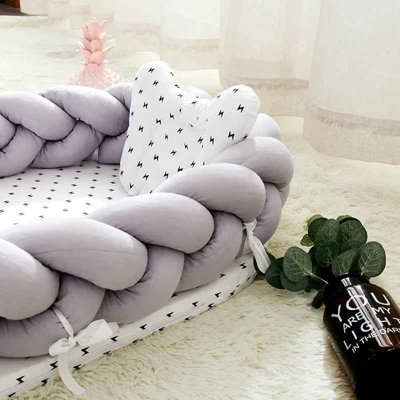 Cocon bébé tresse gris avec attaches sécurisées DoudouSleep