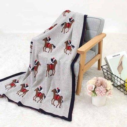 Couverture douce bebe posée sur fauteuil Coton Bambou Premium