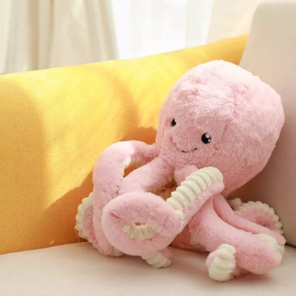 Peluche Pieuvre rose sur fauteuil Doudou Coton