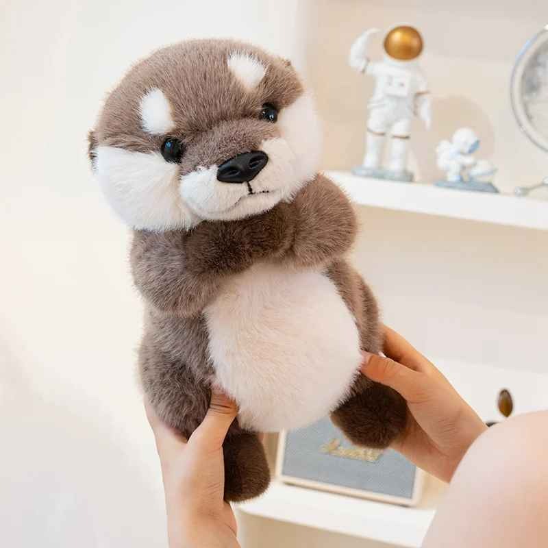 Peluche loutre douce apaisante Observatrice
