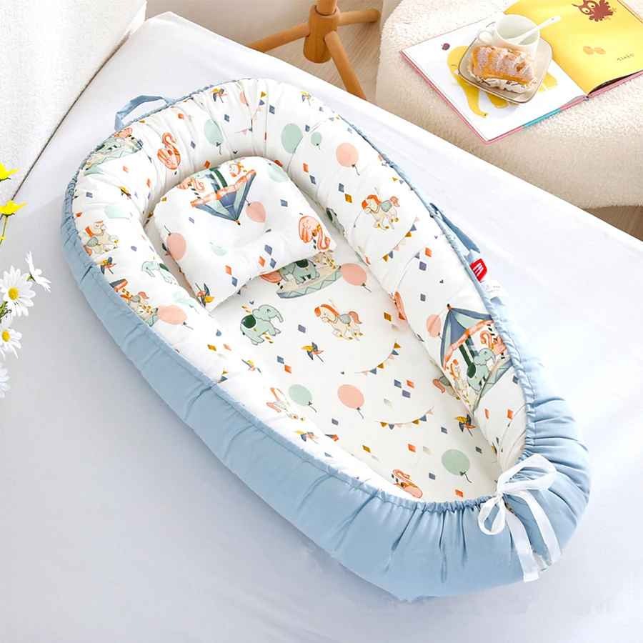 Réducteur de lit bebe avec poignée Cocon Sécurisé