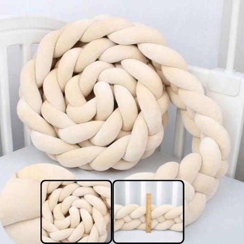 Tresse tour de lit beige enroulée dans berceau Douceur Protectrice