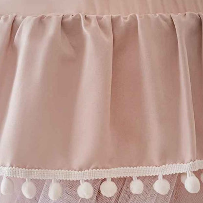 Voile de lit bebe rose avec pompoms Cocon Apaisant