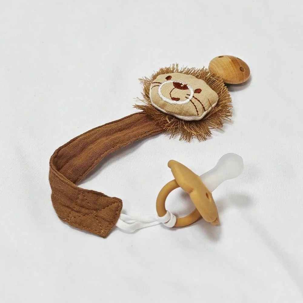Attache tetine en forme lion Sécuriné