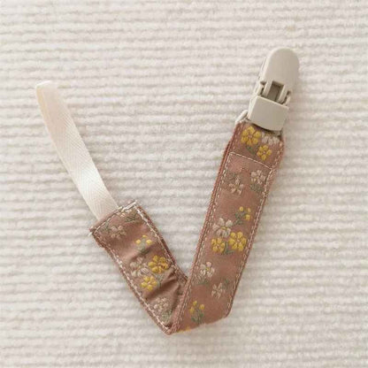 Attache tetine marron Sécurité Stylée