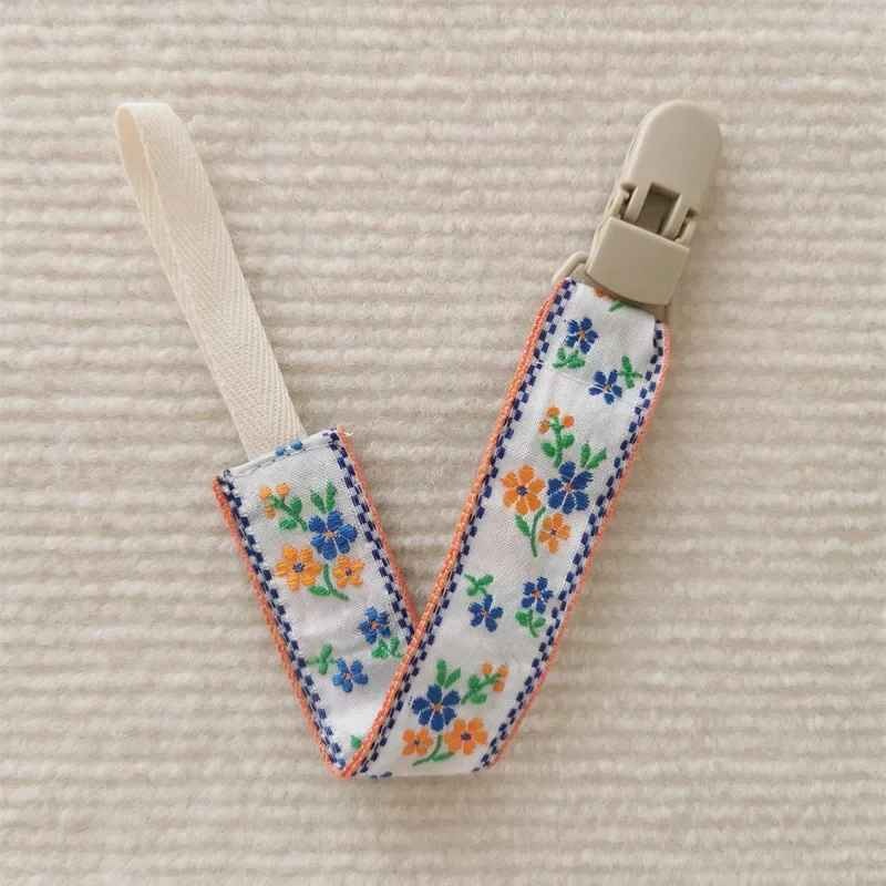 Attache tetine orange Sécurité Stylée