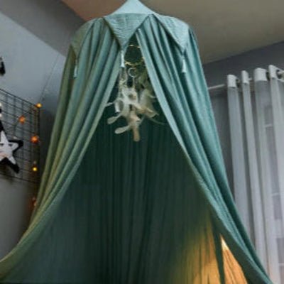 Ciel de lit tissu léger nuage pomponné