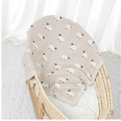 Couverture bébé douce mouton beige dans chambre Sheepy